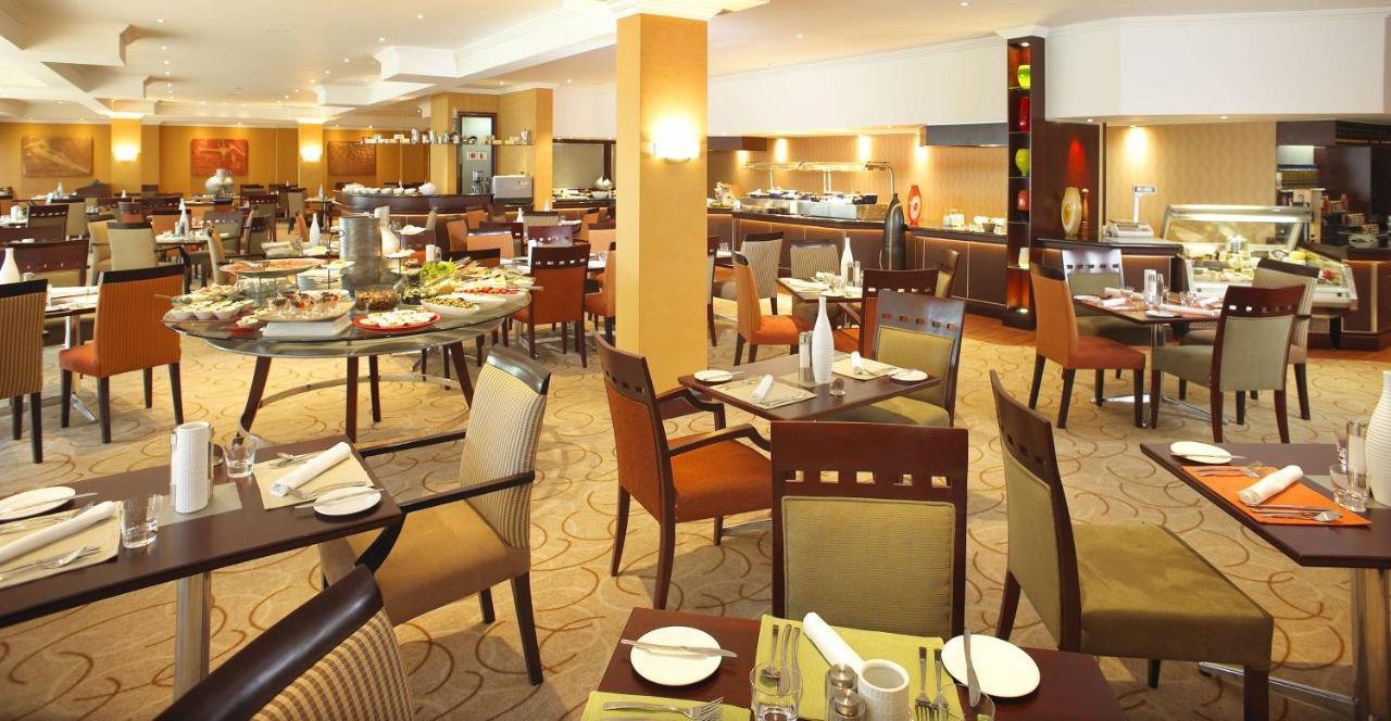 Southern Sun Or Tambo International Airport Hotel Kempton Park Buitenkant foto Restaurant